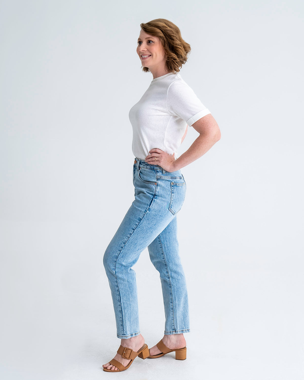 Full length, side view of pear shaped jeans in washed blue colour. Model wears size 8 in average length.