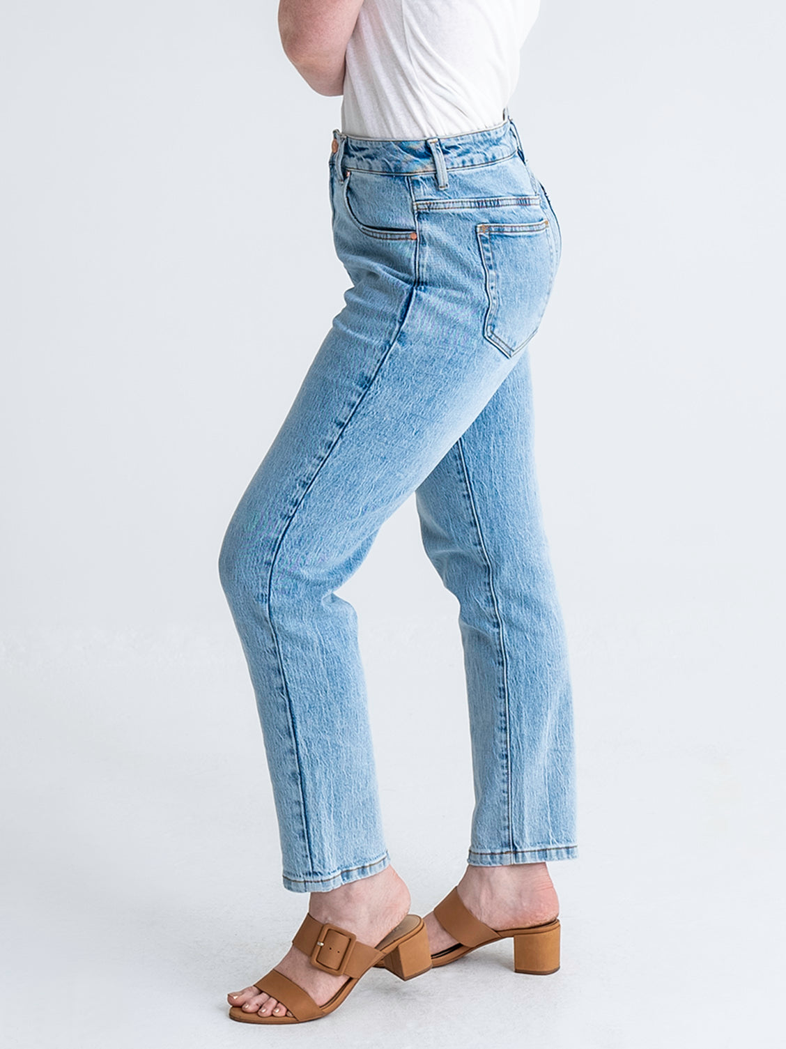 Side view of pear-shaped jeans from waist down in washed blue colour.  Model wears size 8 in average length.